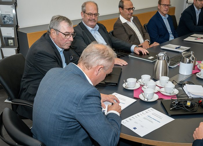 The management signs a contract